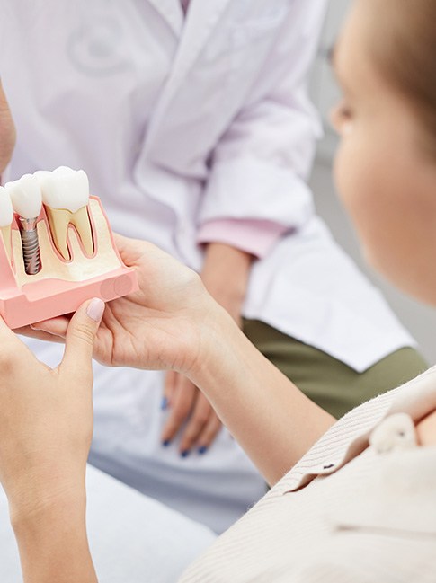 Pleasanton patient learning about dental implant steps
