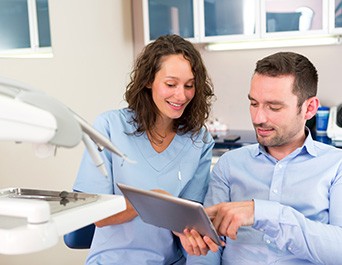 Pleasanton patient discussing dental implants at consultation