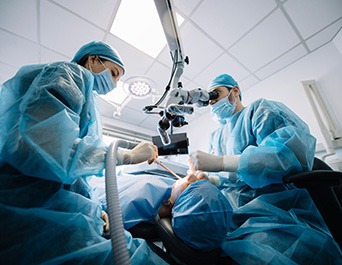 Specialist in Pleasanton placing dental implant post